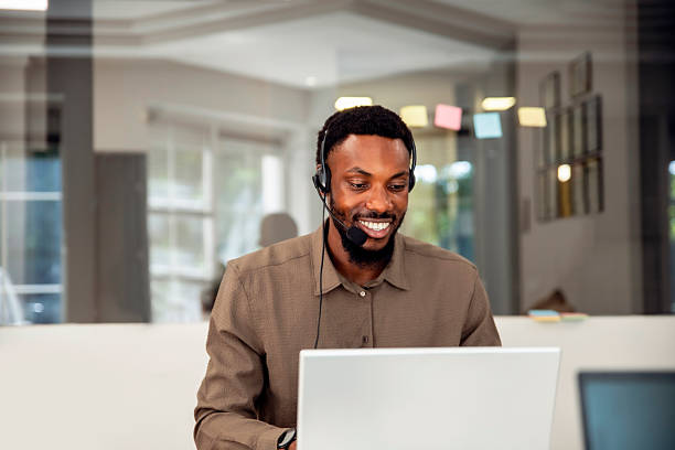 Confident smiling black Man customer service working in modern office